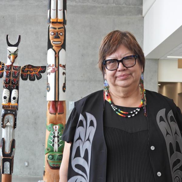 Chancellor, Cloy-e-iss, Dr. Judith Sayers with the Talking Stick and totem