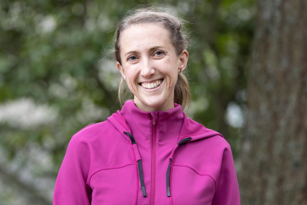 Haley Healey head and shoulders with a forest background